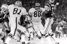 Cleveland Browns defensive ends Jack Gregory (81) and Ron Snidow (88) blast through the New York Jets protection and nab quarterback Joe Namath in the second quarter of their game in Cleveland, Ohio Sept 21, 1970. (AP Photo)
