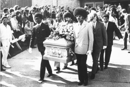 On this date in 1970, rock star Jimi Hendrix died in London at age 27. Here, friends of Hendrix carry his coffin from the church after funeral services, Oct. 1, 1970 in Seattle. (AP Photo/Barry Sweet)