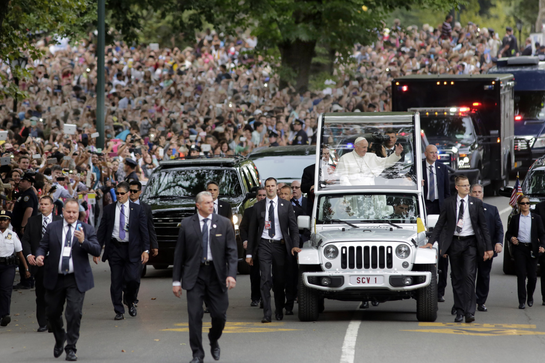 Pope Francis rides the popemobile in New York's Central Park, Friday, Sept. 25, 2015. (AP Photo/Richard Drew, Pool)