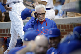 Chicago Cubs manager Joe Maddon looks to his team before a baseball game against the Milwaukee Brewers  Wednesday, Aug. 12, 2015, in Chicago.  (AP Photo/Nam Y. Huh)