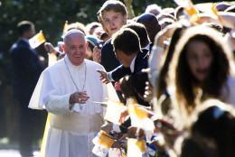 Pope Francis shakes hands with school children as he departs the Apostolic Nunciature, the Vatican's diplomatic mission in Washington, Wednesday, Sept. 23, 2015. Pope Francis will visit the White House, becoming only the third pope to visit the White House.  (AP Photo/Cliff Owen)