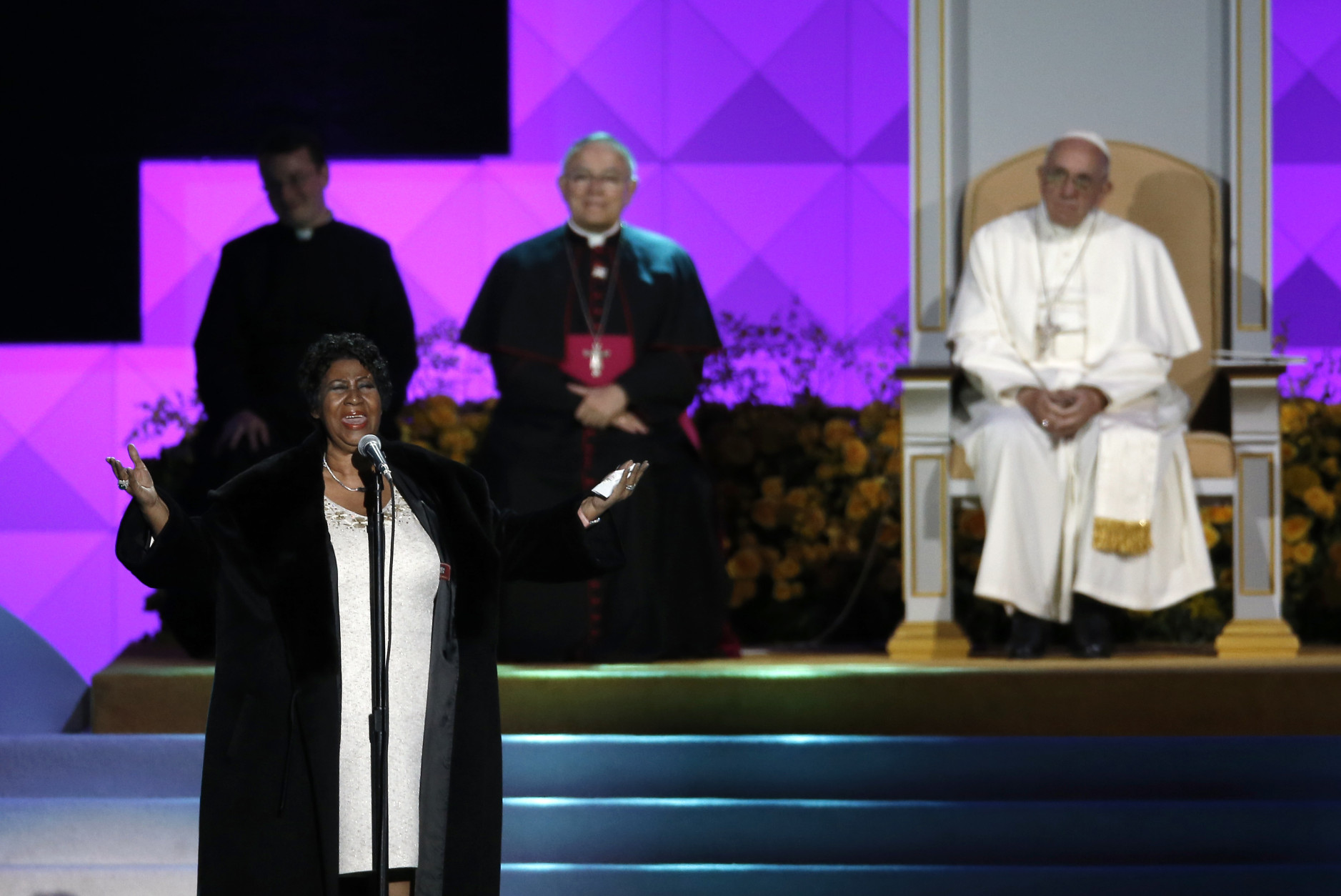Aretha Franklin performs as Pope Francis is seated nearby during the Festival of Families, Saturday, Sept. 26, 2015, in Philadelphia. (AP Photo/Matt Slocum)