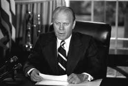 On this date in 1974, President Gerald R. Ford granted a "full, free, and absolute pardon" to former President Richard Nixon covering his entire term in office. Here, Ford tells newsmen, Sept. 8, 1974, in his White House office about the pardon.  Ford then signed the document.  (AP Photo)