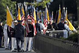Members of the armed services carry U.S. and Vatican flags into the White House in Washington, Wednesday, Sept. 23, 2015, for the upcoming visit by Pope Francis. (AP Photo/Alex Brandon/Pool)