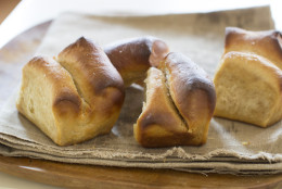 This Oct. 6, 2014, photo shows cider house butter rolls in Concord, N.H. These easy-to-make dinner rolls are inspired by buttery parkerhouse rolls, but are spiced and sweetened with a bit of fresh apple cider that has been boiled down to a syrup. (AP Photo/Matthew Mead)