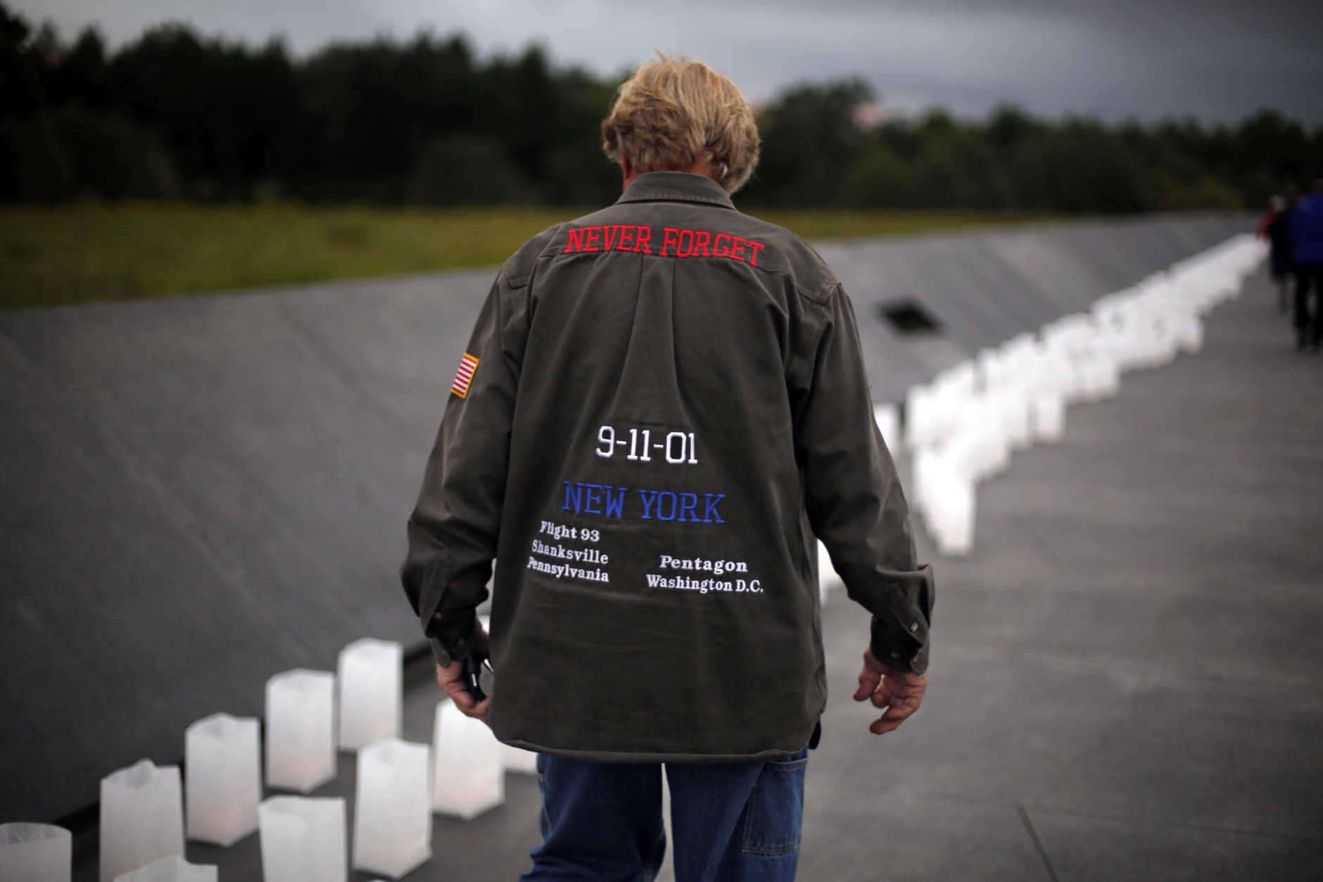 Luminaria line the walkway to the Wall of Names at the Flight 93 National Memorial before a candlelight remembrance in Shanksville, Pa, Thursday, Sept. 10, 2015.  as the nation marks the 14th anniversary of the Sept. 11 attacks. (AP Photo/Gene J. Puskar)