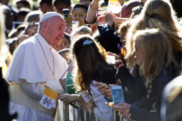 Pope Francis talks with school children as he departs the Apostolic Nunciature, the Vatican's diplomatic mission in the heart of Washington, Wednesday, Sept. 23, 2015. Pope Francis will visit the White House, becoming only the third pope to visit the White House.  (AP Photo/Cliff Owen)