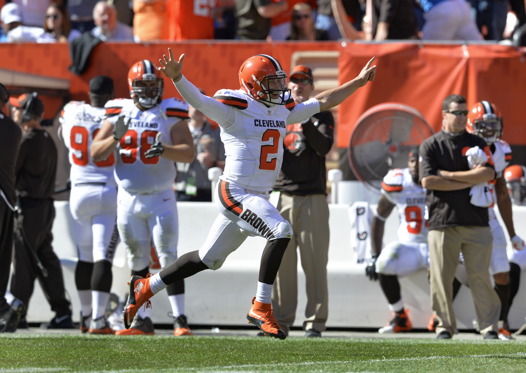 Cleveland Browns quarterback Johnny Manziel (2) celebrates after throwing a 50-yard touchdown pass to Travis Benjamin in the second half of an NFL football game against the Tennessee Titans, Sunday, Sept. 20, 2015, in Cleveland. (AP Photo/Ron Schwane)