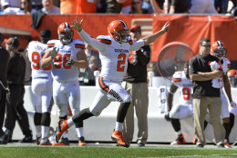 Cleveland Browns quarterback Johnny Manziel (2) celebrates after throwing a 50-yard touchdown pass to Travis Benjamin in the second half of an NFL football game against the Tennessee Titans, Sunday, Sept. 20, 2015, in Cleveland. (AP Photo/Ron Schwane)