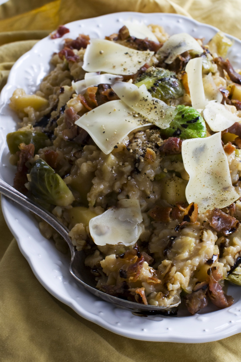 In this image taken Dec. 20, 2012, creamy brown rice risotto two ways recipe for brussels sprouts and apple is shown served on a platter in Concord, N.H. (AP Photo/Matthew Mead)