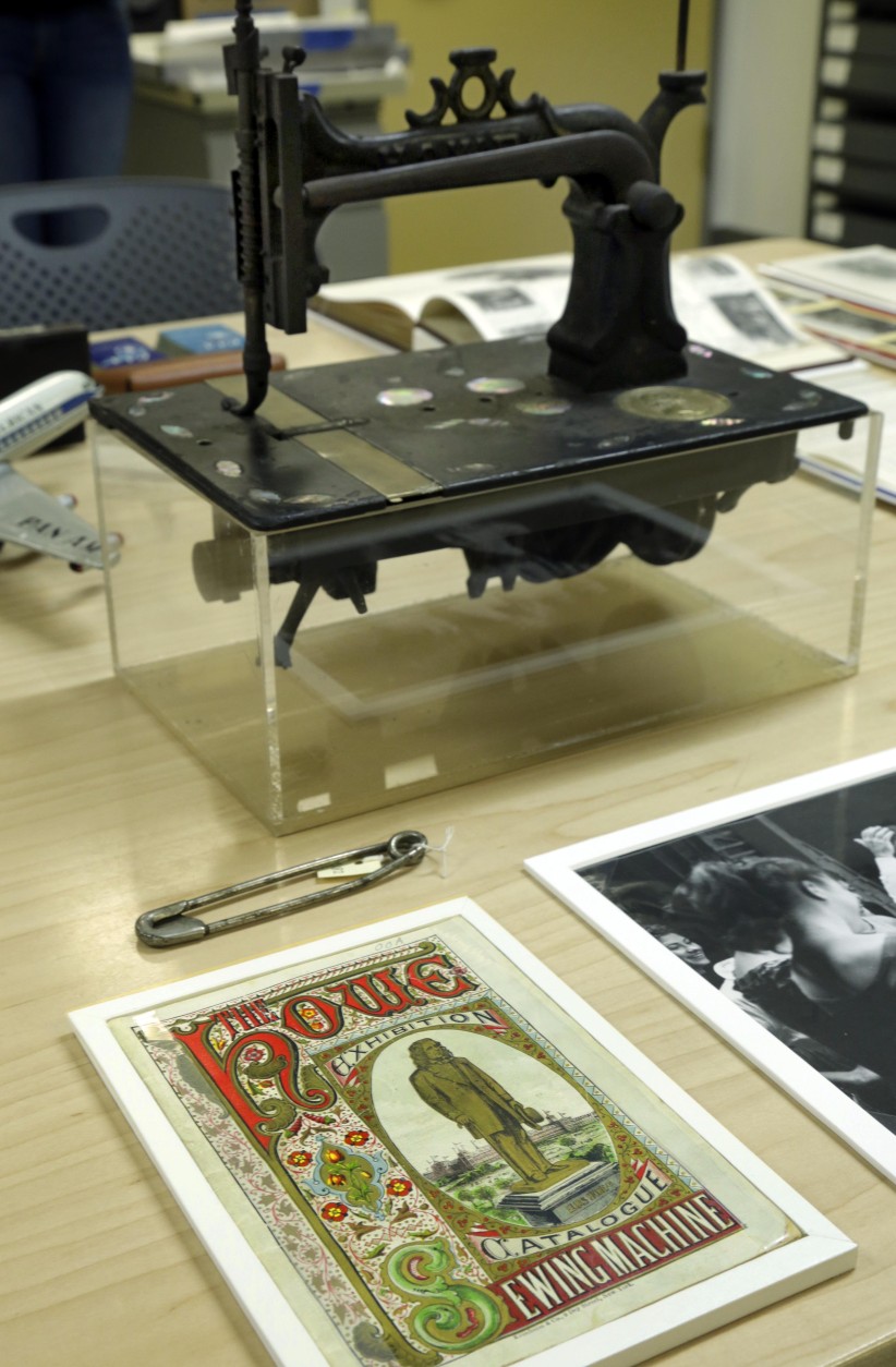 On this date in 1846, Elias Howe received a patent for his sewing machine. Pictured here is a Howe sewing machine and catalog cover on display at the Museum of the City of New York. (AP Photo/Richard Drew)