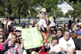 People wave and cheer before a parade for Pope Francis, Wednesday, Sept. 23, 2015 in Washington. (AP Photo/Alex Brandon, Pool)
