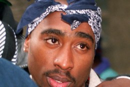 On this date in 1996, rapper Tupac Shakur was shot and mortally wounded on the Las Vegas Strip; he died six days later. Shakur is shown in this Dec. 16, 1993 file photo.   (AP Photo/Kevin Larkin)