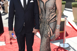 Philip Joncas, left, and Allison Janney arrive at the 67th Primetime Emmy Awards on Sunday, Sept. 20, 2015, at the Microsoft Theater in Los Angeles. (Photo by Dan Steinberg/Invision for the Television Academy/AP Images)