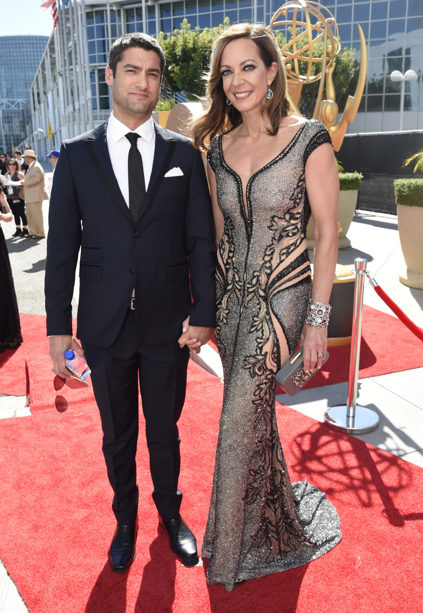 Philip Joncas, left, and Allison Janney arrive at the 67th Primetime Emmy Awards on Sunday, Sept. 20, 2015, at the Microsoft Theater in Los Angeles. (Photo by Dan Steinberg/Invision for the Television Academy/AP Images)