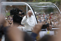 Pope Francis waves to the crowd from his popemobile as it moves through Central Park in New York, Friday, Sept. 25, 2015.  (AP Photo/Kathy Willens)