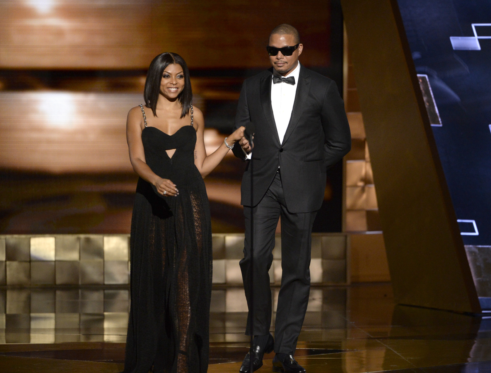 Taraji P. Henson, left, and Terrence Howard presents the award for outstanding writing for a limited series, movie or a dramatic special at the 67th Primetime Emmy Awards on Sunday, Sept. 20, 2015, at the Microsoft Theater in Los Angeles. (Photo by Phil McCarten/Invision for the Television Academy/AP Images)
