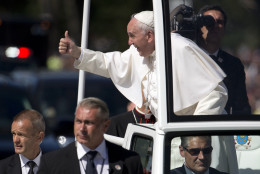 Pope Francis give the thumbs-up from the popemobile during a parade around the Ellipse near the White House in Washington, Wednesday, Sept. 23, 2015. (AP Photo/Carolyn Kaster)