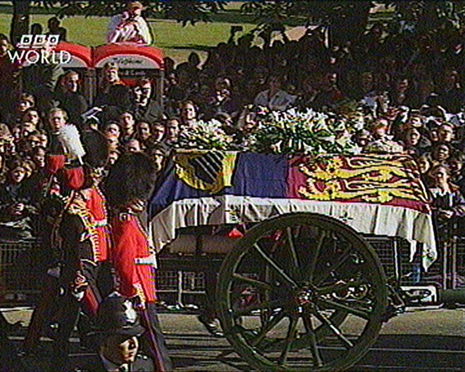 The gun carriage bearing the coffin of the Princess Diana, draped in the Royal Standard, leaves London's Kensington Palace on route for the funeral service at London's, Westminster Abbey, Saturday September 6 1997, in this image made from television. Princess Diana was killed in a car crash in Paris on Aug. 31, along with her boyfriend Dodi Fayed. Following the funeral Princess Diana will be buried at Althorp, 60 miles northwest of London at the Spencer stately home. (AP Photo)