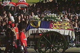 The gun carriage bearing the coffin of the Princess Diana, draped in the Royal Standard, leaves London's Kensington Palace on route for the funeral service at London's, Westminster Abbey, Saturday September 6 1997, in this image made from television. Princess Diana was killed in a car crash in Paris on Aug. 31, along with her boyfriend Dodi Fayed. Following the funeral Princess Diana will be buried at Althorp, 60 miles northwest of London at the Spencer stately home. (AP Photo)