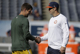 Green Bay Packers quarterback Aaron Rodgers, left, and Chicago Bears quarterback Jay Cutler greet each other before their NFL football game, Sunday, Sept. 13, 2015, in Chicago. (AP Photo/Nam Y. Huh)