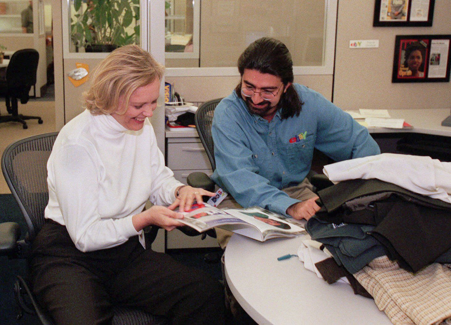 On this date in 1995, the online auction site eBay was founded in San Jose, California, by Pierre Omidyar under the name "AuctionWeb." In this 1999 file photo, then eBay chief executive officer Meg Whitman, left, and Pierre Omidyar, eBay's founder and chairman of the board, leaf through a magazine at the company's headquarters in San Jose, Calif.  (AP Photo/Randi Lynn Beach, file)