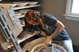 From sketching the prototypes to designing the product and putting it in production, Kendrick completes the entire process in-house — quite literally. Her two pottery wheels are in her townhome’s spare bedroom, and her kilns are in the backyard shed. In 2014, her partner Ernie Niblack joined in to help Kendrick run the growing business. (WTOP/Rachel Nania)
