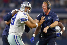ARLINGTON, TX - SEPTEMBER 13:  Tony Romo #9 of the Dallas Cowboys celebrates with head coach Jason Garrett of the Dallas Cowboys after scoring the game winning touchdown against the New York Giants at AT&amp;T Stadium on September 13, 2015 in Arlington, Texas.  (Photo by Tom Pennington/Getty Images)