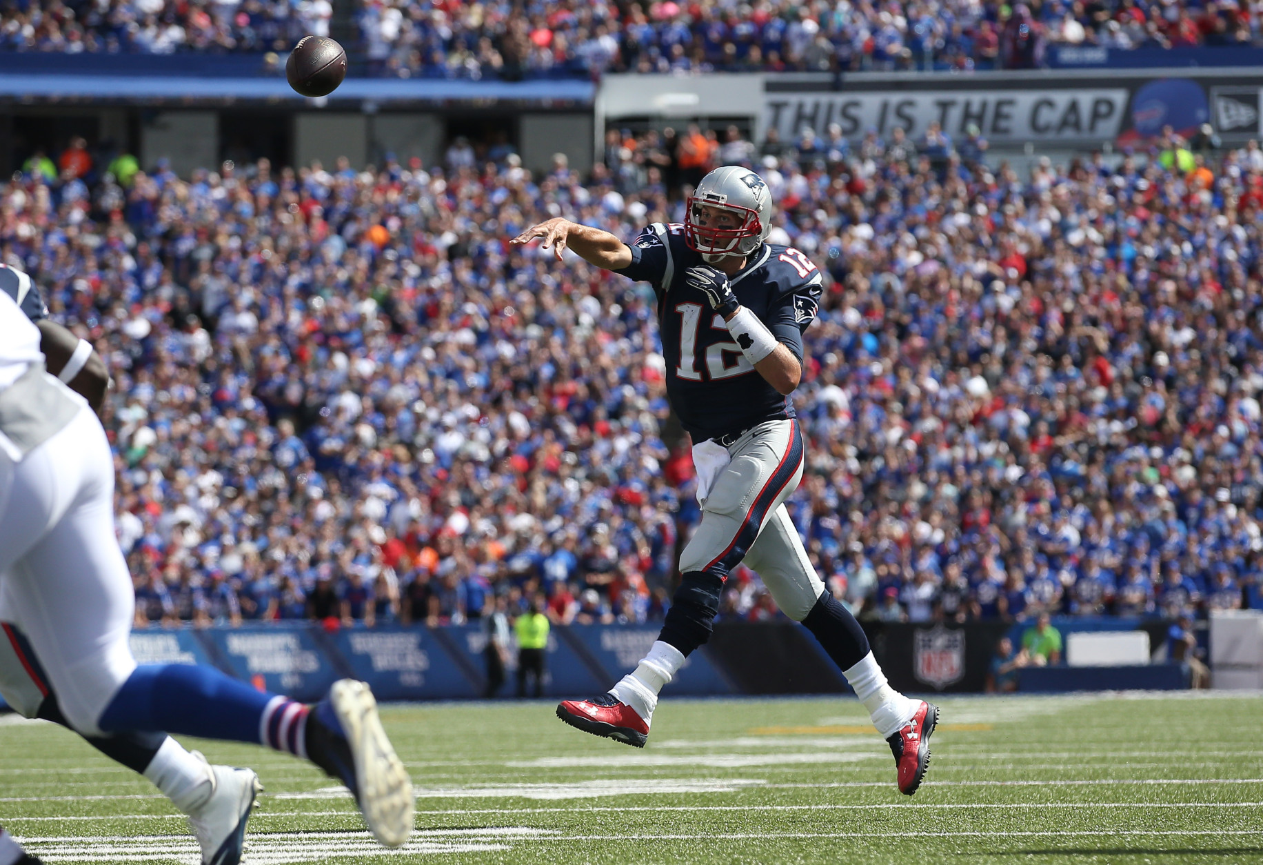 ORCHARD PARK, NY - SEPTEMBER 20: Tom Brady #12 of the New England Patriots throws a touchdown pass during NFL game action against the Buffalo Bills at Ralph Wilson Stadium on September 20, 2015 in Orchard Park, New York. (Photo by Tom Szczerbowski/Getty Images)