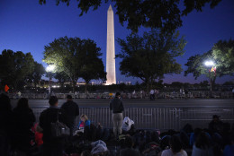 WASHINGTON, DC - SEPTEMBER 23: Spectators wait as early as 5 am along the parade route of pope Francis around the Ellipse, south of the White House, September 23, 2015  in Washington, DC. After visiting President Obama at the White House the Pope will step into his popemobile for the parade. (Photo by Astrid Riecken/Getty Images)