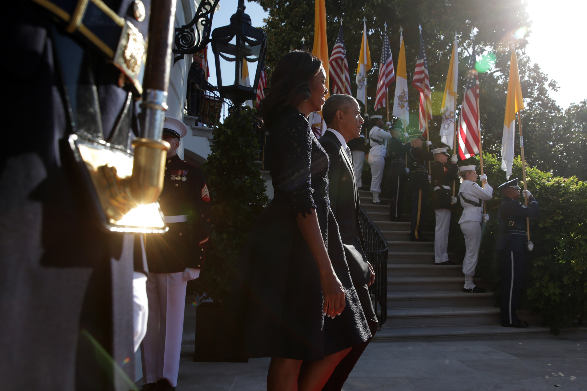 WASHINGTON, DC - SEPTEMBER 23:  U.S. President Barack Obama and first Lady Michelle Obama walk out to welcome Pope Francis prior to his arrival ceremony at the White House on September 23, 2015 in Washington, DC. The Pope begins his first trip to the United States at the White House followed by a visit to St. Matthew's Cathedral, and will then hold a Mass on the grounds of the Basilica of the National Shrine of the Immaculate Conception.  (Photo by Alex Wong/Getty Images)