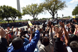 WASHINGTON, DC - SEPTEMBER 23: Spectators wave to Pope Francis during a parade on the streets around the Ellipse, south of the White House, September 23, 2015  in Washington, DC. Thousands of people gathered near the Ellipse to catch a glimpse of Pope Francis after he addressed an audience of 15,000 invited guests on the South Lawn of the White House during an official arrival ceremony with President Barack Obama. The Pope began his first trip to the United States at the White House followed by a visit to St. Matthew's Cathedral, and will then hold a Mass on the grounds of the Basilica of the National Shrine of the Immaculate Conception. (Photo by Astrid Riecken/Getty Images)