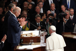 WASHINGTON, DC - SEPTEMBER 24:  Pope Francis is greeted by Vice President Joe Biden (L) and Speaker of the House John Boehner (R-OH) as he arrives to speak during a joint meeting of the U.S. Congress in the House Chamber of the U.S. Capitol on September 24, 2015 in Washington, DC.  Pope Francis is the first pope to address a joint meeting of Congress and will finish his tour of Washington later today before traveling to New York City.  (Photo by Win McNamee/Getty Images)