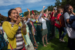 WASHINGTON, D.C. - SEPTEMBER 24: Spectators on the West Front of the U.S. Capitol building react as Pope Francis makes an appearance on the West Front Speaker's office balcony, September 24, 2015 in Washington, DC. Pope Francis is the first pope to address a joint meeting of Congress and will finish his tour of Washington later today before traveling to New York City. (Photo by Allison Shelley/Getty Images)