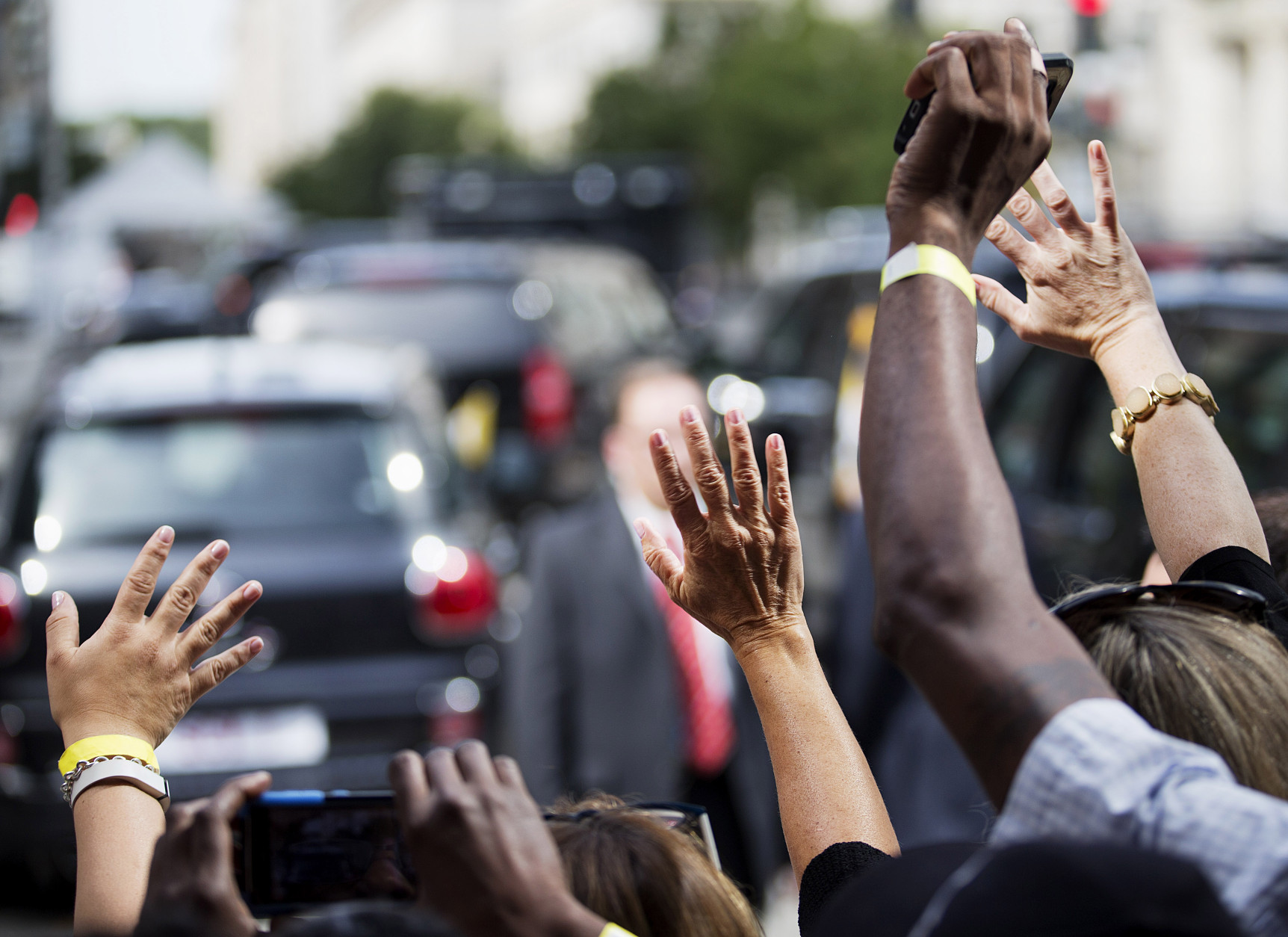 WASHINGTON, DC - SEPTEMBER 24: People wave as Pope Francis leaves in his Fiat after a visit to Catholic Charities of the Archdiocese of Washington September 24, 2015 in Washington, DC. Pope Francis is in the United States for six days during his first trip as the leader of the Catholic Church. (Photo by David Goldman-Pool/Getty Images)