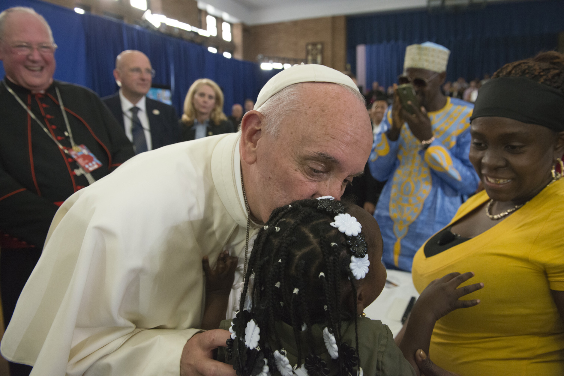 NEW YORK, NY - SEPTEMBER 25: Pope Francis greets people inside Our Lady Queen of Angels School September 25, 2015 in the East Harlem neighborhood of New York City. Pope Francis is in New York on a two day visit and will carry out a number of engagements including a Papal motorcade through Central Park and a Mass in Madison Square Garden. (Photo by Stephanie Keith-Pool/Getty Images)