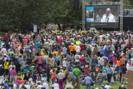 PHILADELPHIA, PA - SEPTEMBER 26:   A crowd watches Pope Francis speak on a jumbotron from the Cathedral Basilica of Saints Peter and Paul on Independence Mall September 26, 2015 in Philadelphia., Pennsylvania. After visiting Washington and New York City, Pope Francis concludes his tour of the U.S. with events in Philadelphia on Saturday and Sunday. Photo by Laurence Kesterson-Pool/Getty Images)