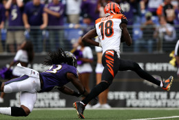 BALTIMORE, MD - SEPTEMBER 27: Wide receiver A.J. Green #18 of the Cincinnati Bengals scores a fourth quarter touchdown past free safety Kendrick Lewis #23 of the Baltimore Ravens during a game at M&amp;T Bank Stadium on September 27, 2015 in Baltimore, Maryland. (Photo by Patrick Smith/Getty Images)
