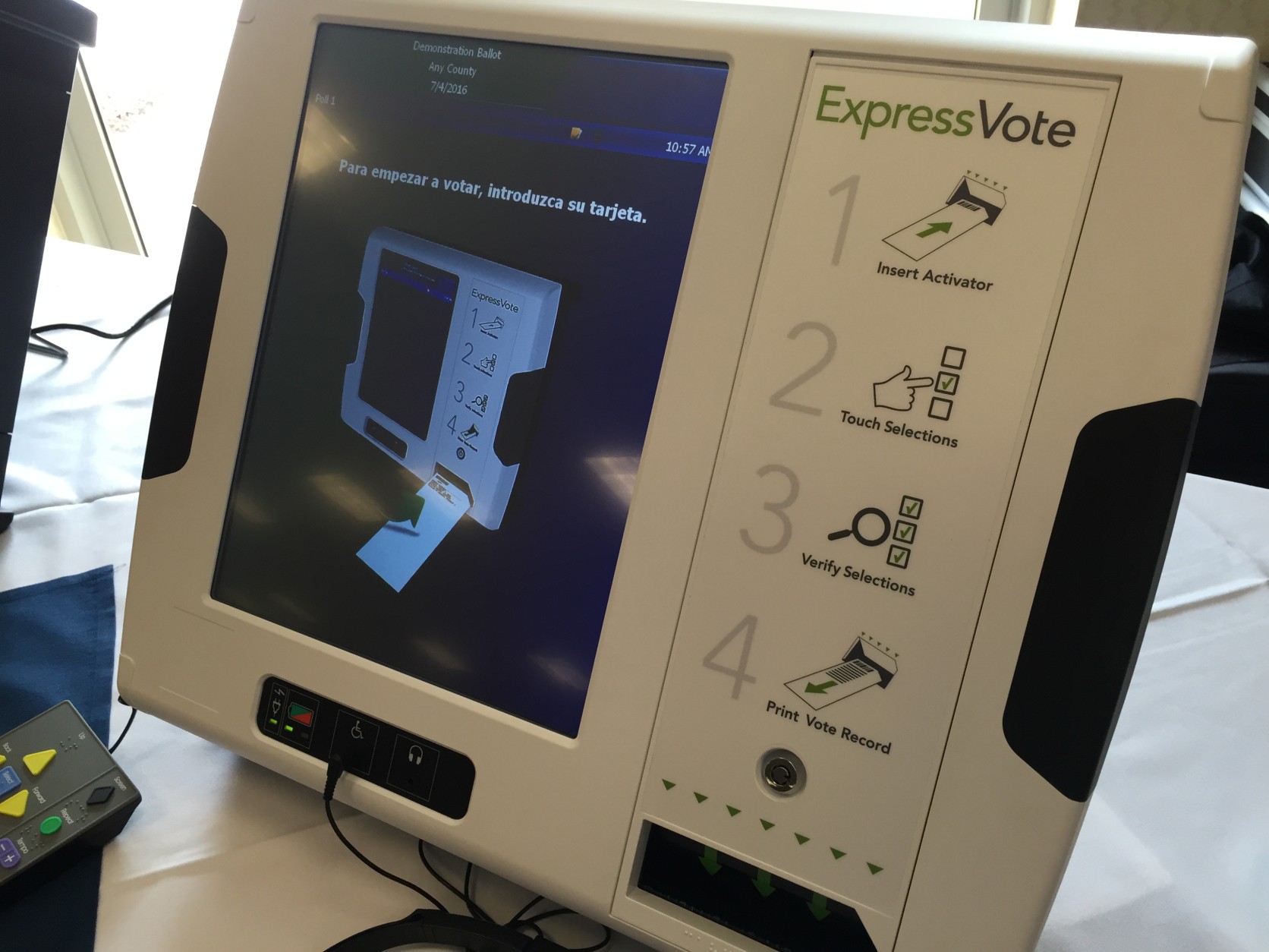 The new voting machines will record a paper ballot. Voters will make their selection on a touchscreen, which will then print out their selections to be electronically scanned. (WTOP/Andrew Mollenbeck)