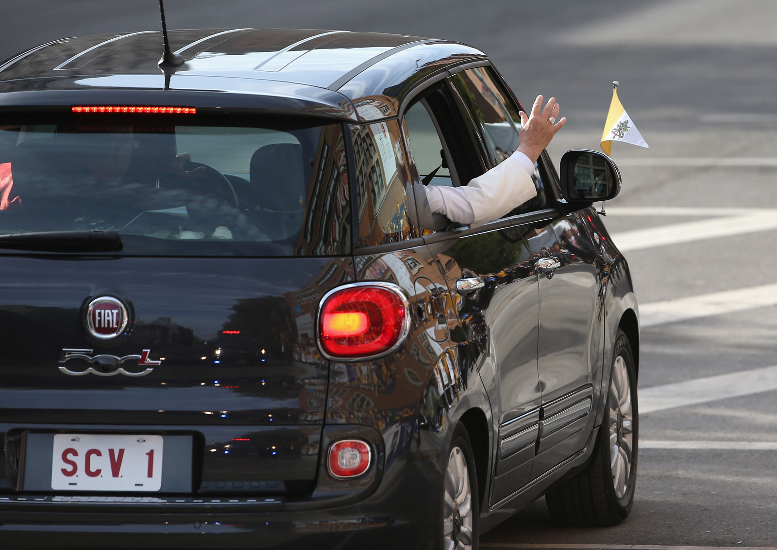NEW YORK, NY - SEPTEMBER 25:  Pope Francis arrives in his Fiat to the Lady Queen of Angels school on September 25, 2015 in the Harlem neighborhood of New York City. The Pope visited the inner city Catholic school in east Harlem and met with children, immigrants and Catholic Charities workers on the second day of his visit to New York City.  (Photo by John Moore/Getty Images)