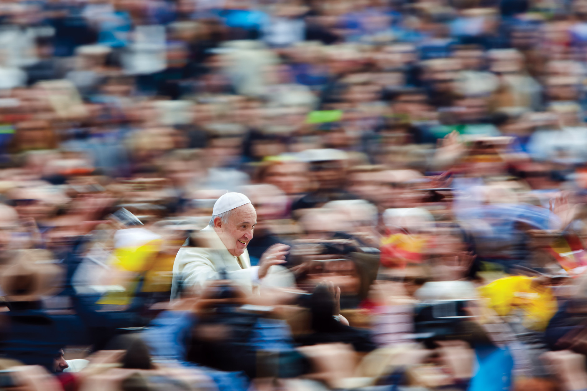 A swirl of pilgrims surround Pope Francis in St. Peter’s Square. (Dave Yoder/National Geographic)