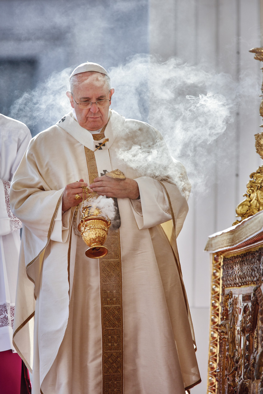 Pope Francis performs a ritual during a ceremony. (Dave Yoder/National Geographic)