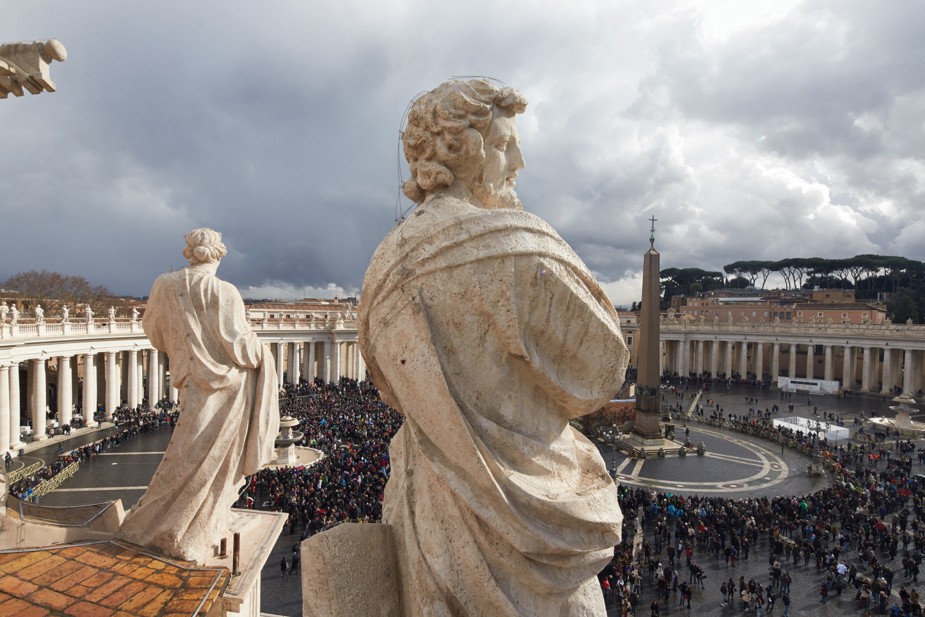 A saint’s-eye view of St. Peter’s Square gives the perspective from 2 of the 140 statues of saints that line the balustrade above the colonnade. The 82-foot-high Egyptian obelisk can be seen in the square. (Dave Yoder/National Geographic)
