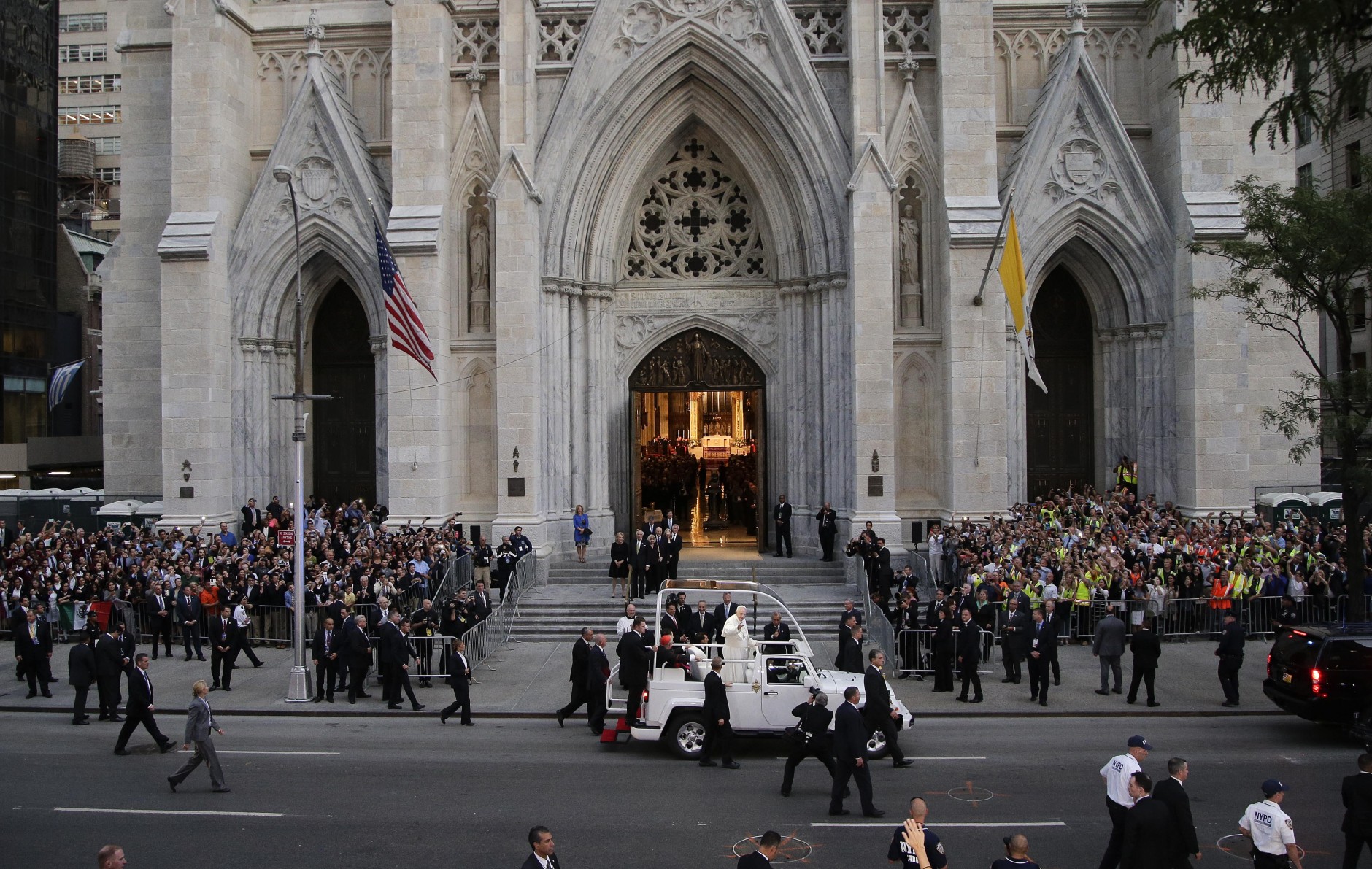Pope Francis waves as he arrives at St. Patrick's Cathedral to lead an evening prayer service, Thursday, Sept. 24, 2015, in New York. (AP Photo/Julie Jacobson)
