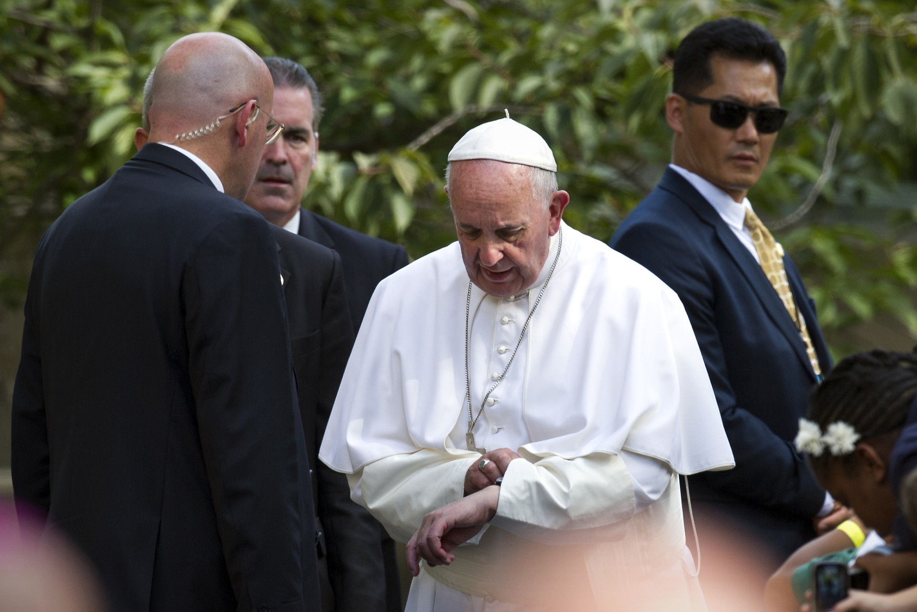 Pope Francis checks his watch as he prepares to depart the Apostolic Nunciature, the Vatican's diplomatic mission in the heart of Washington, en route to Andrews Air Force Base, Thursday, Sept. 24, 2015. The Pope's next stop is New York before heading to Philadelphia.  (AP Photo/Cliff Owen)
