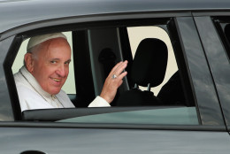 JOINT BASE ANDREWS, MD - SEPTEMBER 22:  Pope Francis waves from the back of his Fiat after arriving from Cuba September 22, 2015 at Joint Base Andrews, Maryland. Francis will be visiting Washington, New York City and Philadelphia during his first trip to the United States as pope.  (Photo by Chip Somodevilla/Getty Images)
