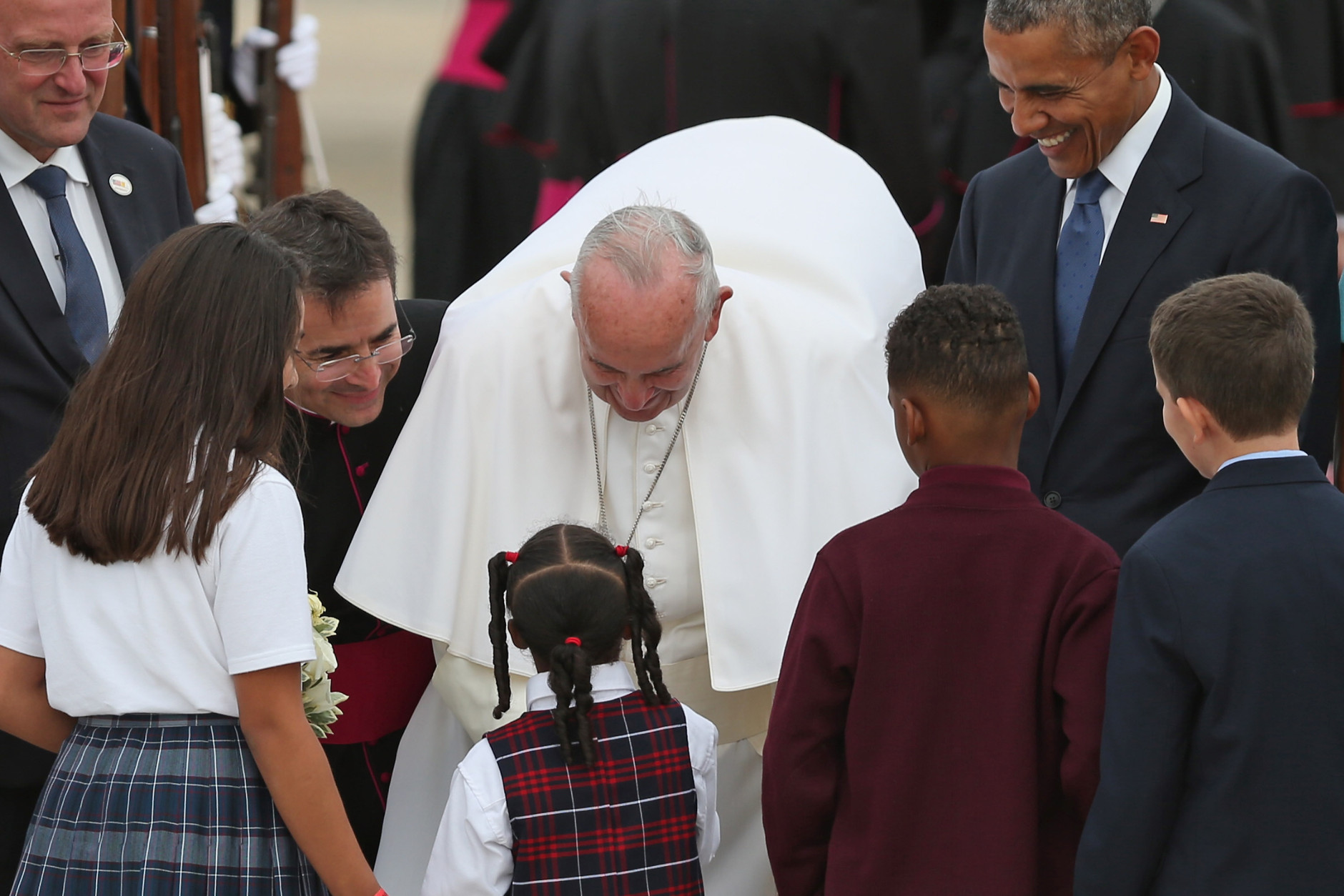 JOINT BASE ANDREWS, MD - SEPTEMBER 22:  Pope Francis is greeted by a group of Catholic school children after being welcomed by U.S. President Barack Obama (R) and other political and Catholic church leaders after arriving from Cuba September 22, 2015 at Joint Base Andrews, Maryland. Francis will be visiting Washington, New York City and Philadelphia during his first trip to the United States as Pope.  (Photo by Chip Somodevilla/Getty Images)