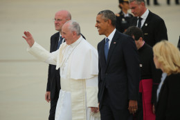 JOINT BASE ANDREWS, MD - SEPTEMBER 22:  Pope Francis is greeted by U.S. President Barack Obama (R), along with first lady Michelle Obama, Vice President Joe Biden and other political and Catholic church leaders after arriving from Cuba September 22, 2015 at Joint Base Andrews, Maryland. Francis will be visiting Washington, New York City and Philadelphia during his first trip to the United States as pope. (Photo by Chip Somodevilla/Getty Images)