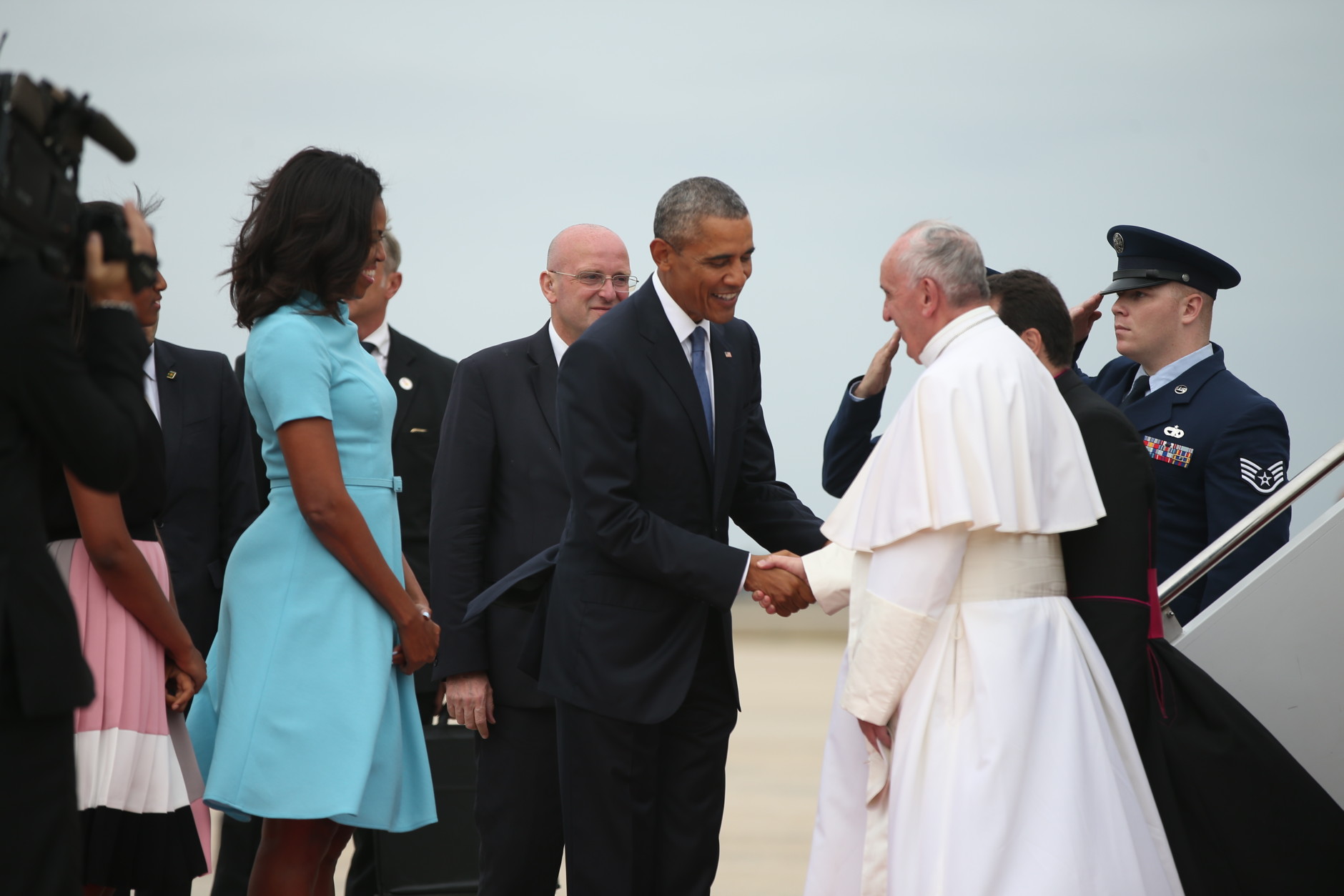 President Barack Obama and first lady Michelle Obama greet Pope Francis upon his arrival at Andrews Air Force Base, Md., Tuesday, Sept. 22, 2015. (AP Photo/Andrew Harnik)