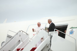 Pope Francis waves upon his arrival at Andrews Air Force Base, Md., Tuesday, Sept. 22, 2015, where President, Mrs. Obama, and others were to greet him. (AP Photo/Andrew Harnik)